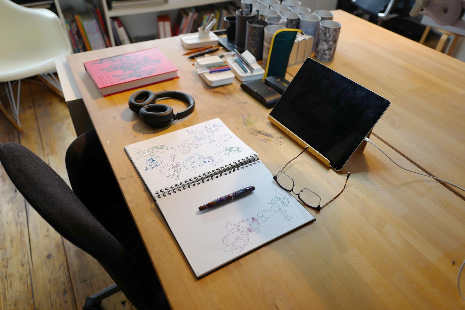 example of a desk that has been uncluttered so that art can be created on it
